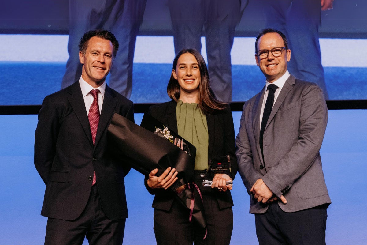 Solicitor receiving award from NSW Premier