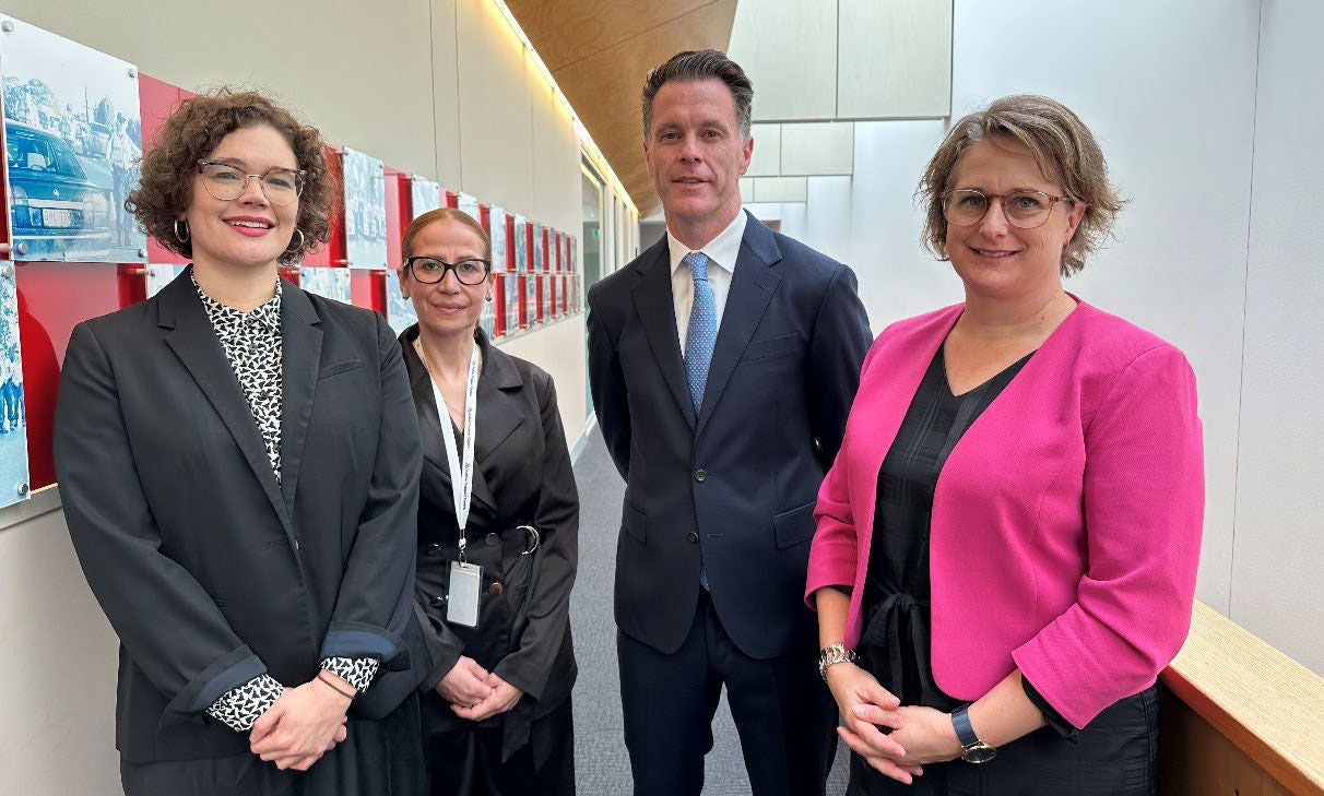 Women’s Domestic Violence Court Advocacy Program Unit manager Alice Stiles, South West Sydney Women’s Domestic Violence Court Advocacy Service manager Farah Assafiri, Premier The Hon Chris Minns and Domestic Violence Unit Solicitor in Charge Gabrielle Cantrall attend a press conference announcing $7.5 million in additional funding for two pilot programs run by Women's Domestic Violence Court Advocacy Services.